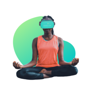 woman sitting cross legged with vr goggles