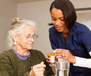 Professional caregiver administering medication
